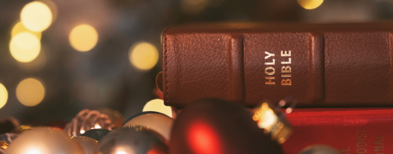 Family celebrating Christmas morning with stockings and presents, Christians debating Santa tradition