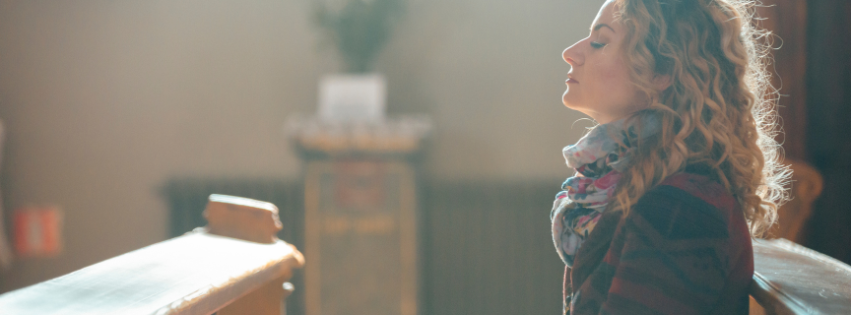 Person in church pew during church search looking for healthy church green flags
