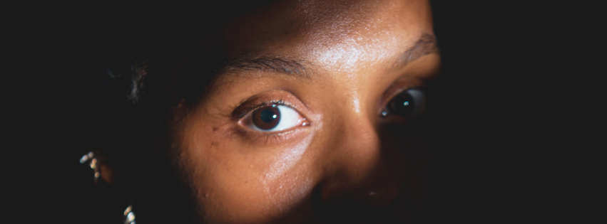 Christian woman struggling with anxiety in church wondering is anxiety a sin?