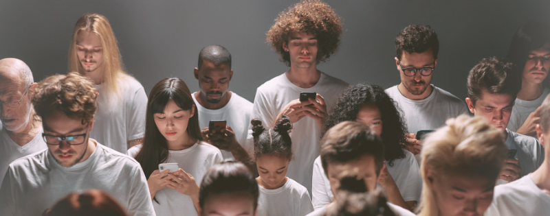 Reaching for a phone in a crowd instead of sitting in silence — social media and attention