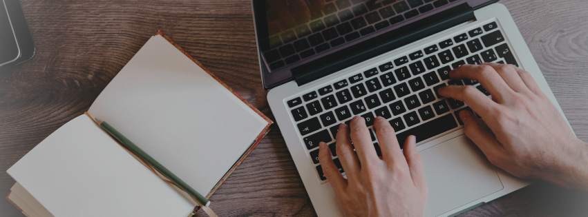 Woman sitting at desk writing about spiritual gifts